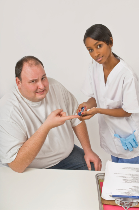 Nurse checking blood glucose